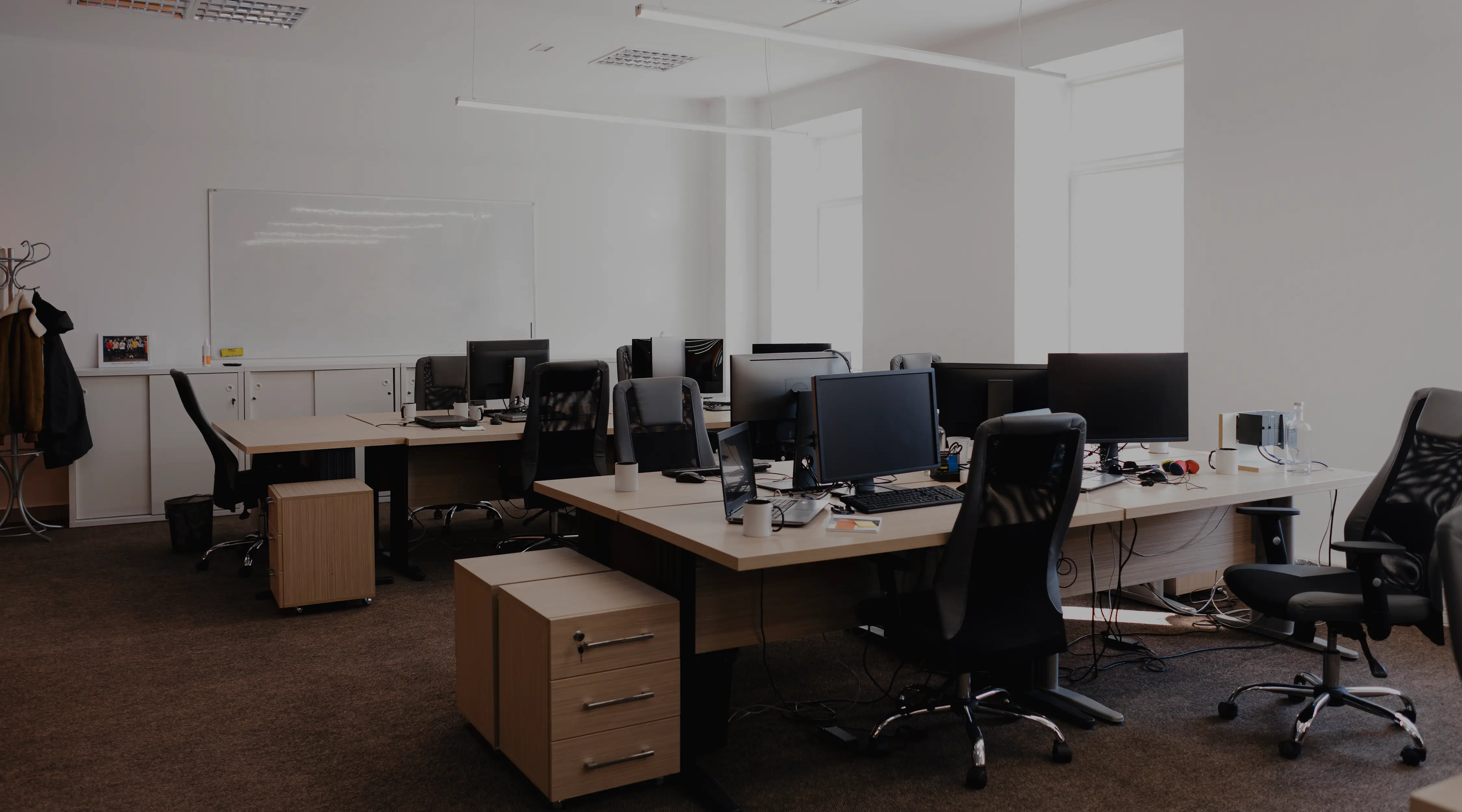 Modern office interior with digital signage showing company updates.
